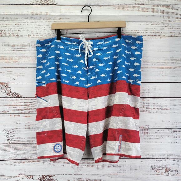 Pelagic Sharkskin Men’s 40 Red Blue American Camo Board Shorts Fish Print - Picture 1 of 15
